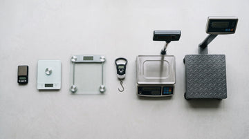 Six types of weighing machine arranged by size from pocket jewellery scale to industrial platform scale