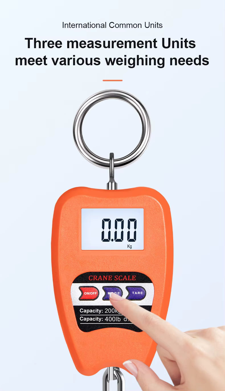 Orange digital crane scale with a hand pressing the mode change button on a light gray background